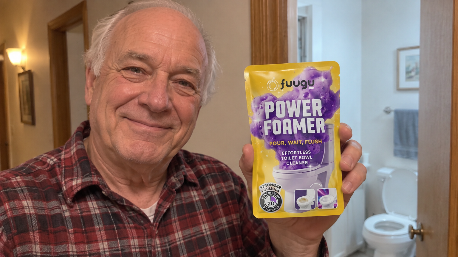 Older man in a plaid flannel shirt holding a Fuugu pouch in a bathroom doorway